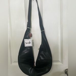 The sash NWT faux leather reversible bag
